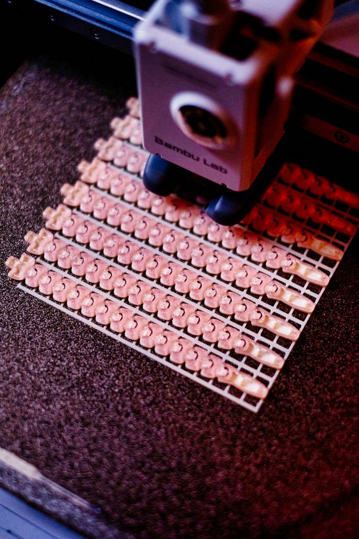 Menus Close-up of a 3D printer creating intricate patterns. Focus on precision and technology.